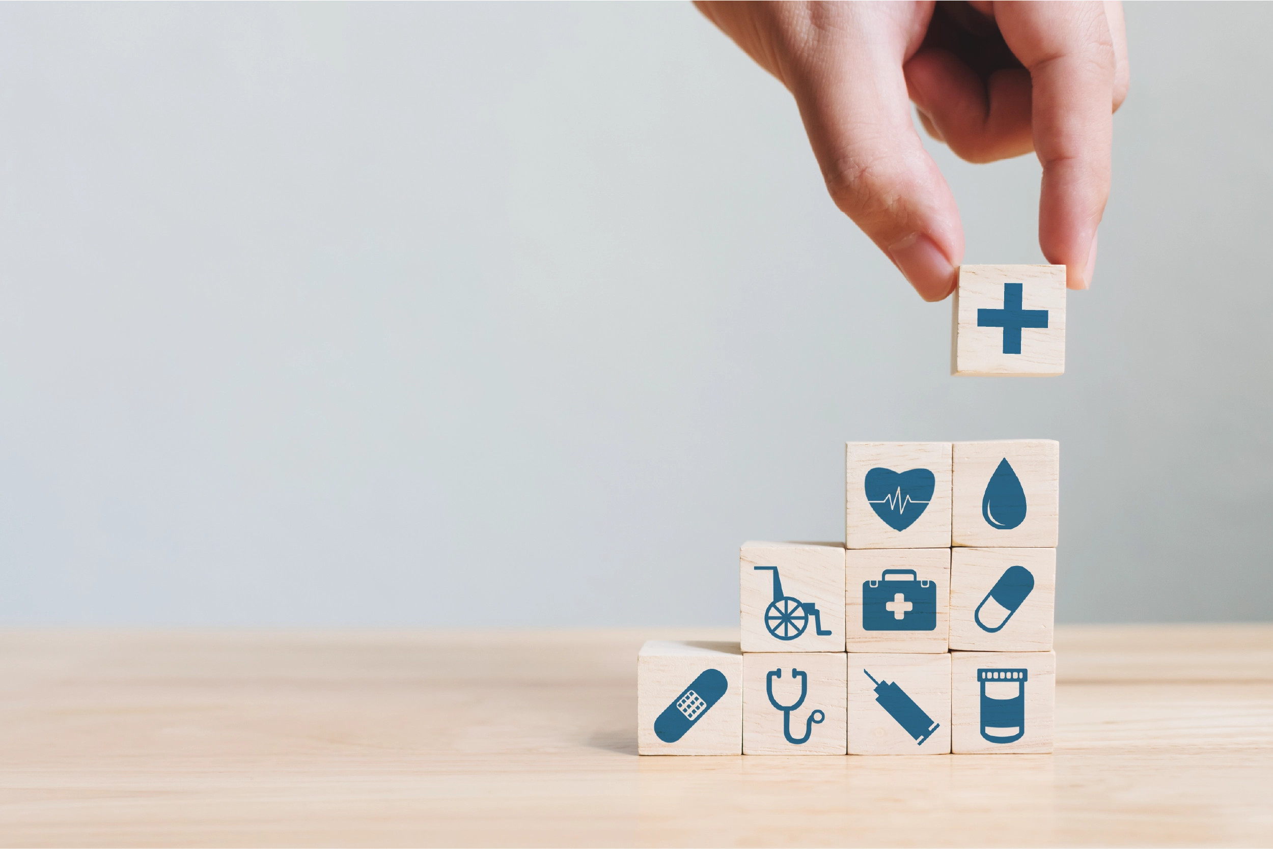 Wooden blocks with different healthcare icons